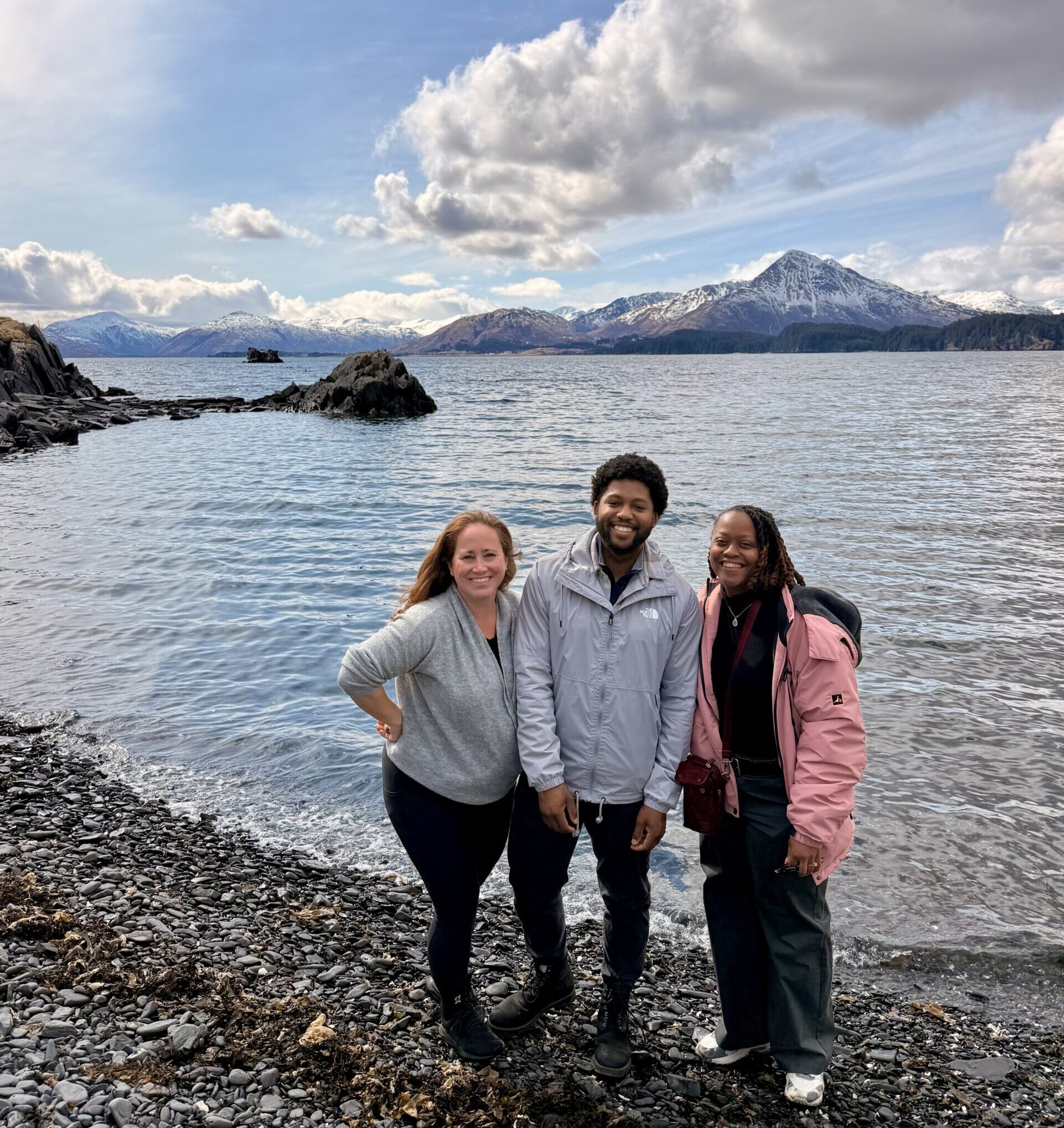 Carbon180 team members explore a beach outside of Kodiak
