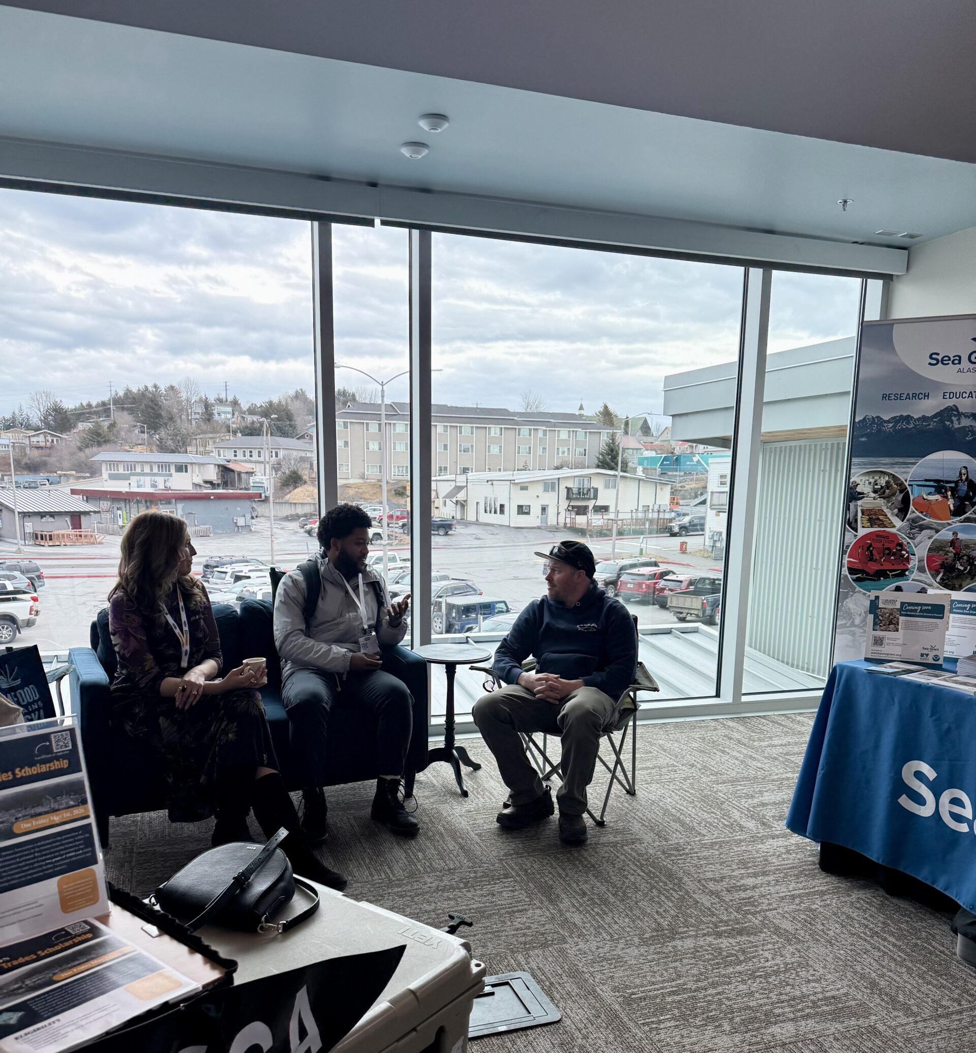 Engaging in conversations about mCDR at the Kodiak Seiners Association booth during ComFish with fisherman Nate Rose, captain of the F/V June Sea.