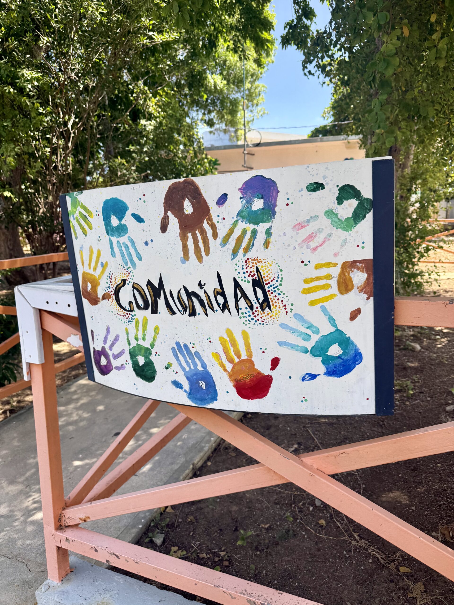 The campus is laden with well cared for trees and signs that read comunidad, ujamaa, and aprendizaje